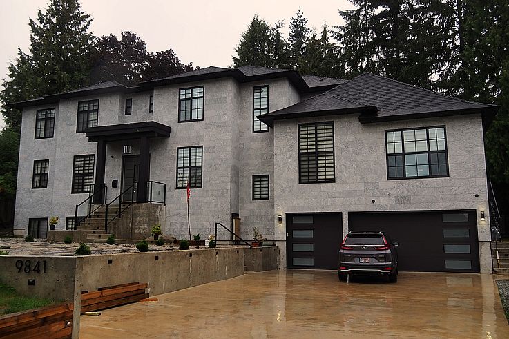 Grey stone facade of a modern house in the Whalley neighborhood of Surrey.