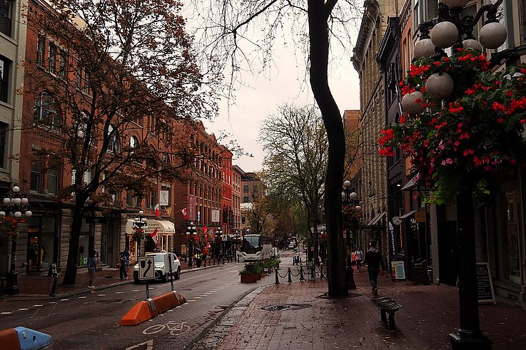 Brick buildings and pedestrian street in autumn in the Gastown neighborhood, Water Street, Vancouver.