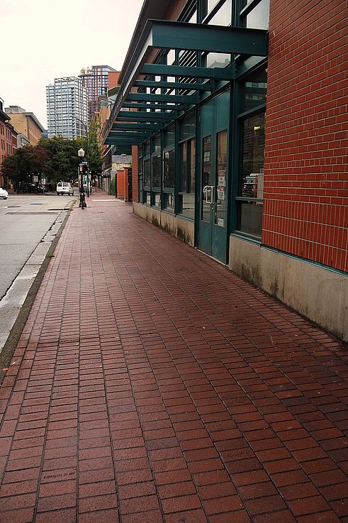 Brick sidewalk on Alexander Street, in the historic Gastown neighborhood of Vancouver.