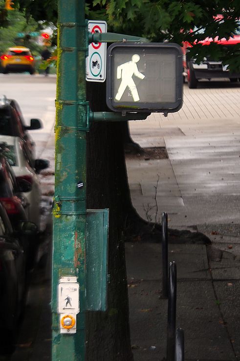 Pedestrian signal lit up on Alexander Street in the Gastown district of Vancouver.