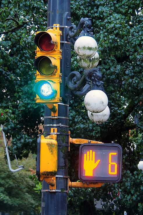 Traffic light and pedestrian signal on a historic lamppost in the Gastown district, Vancouver.