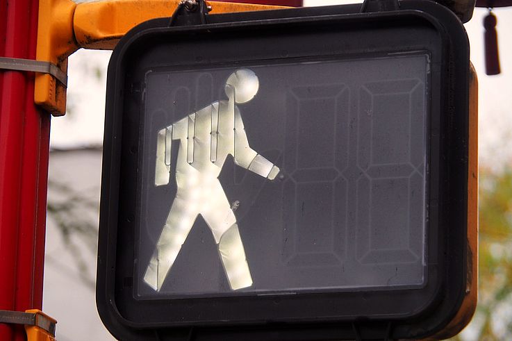 Illuminated pedestrian signal in the Chinatown district, on East Pender Street in Vancouver.