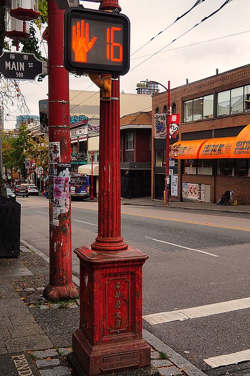 Red lamppost at the intersection of Main and Pender streets, Chinatown district, Vancouver.
