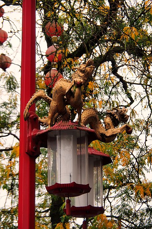 Lamppost adorned with dragons in the Chinatown district, Pender Street in Vancouver.