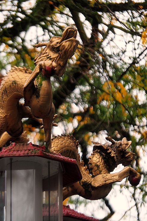Golden dragon-shaped ornaments on a lamppost in the Chinatown district, Vancouver.