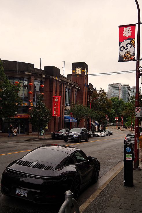 Porsche parked in front of the Chinatown Plaza and the Vancouver Cultural Centre on Keefer Street.