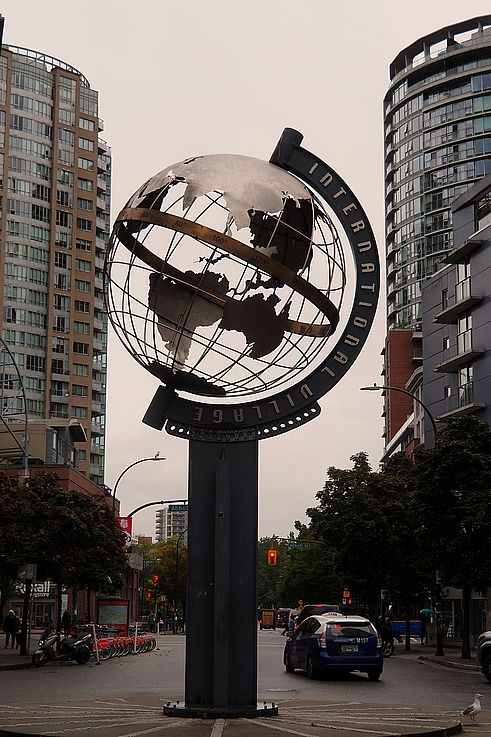 International Village metal globe at the intersection in Chinatown, Vancouver.