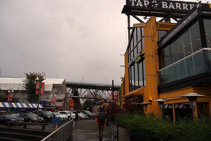 Tap & Barrel restaurant on Granville Island, with the Granville Street bridge in the background in Vancouver.